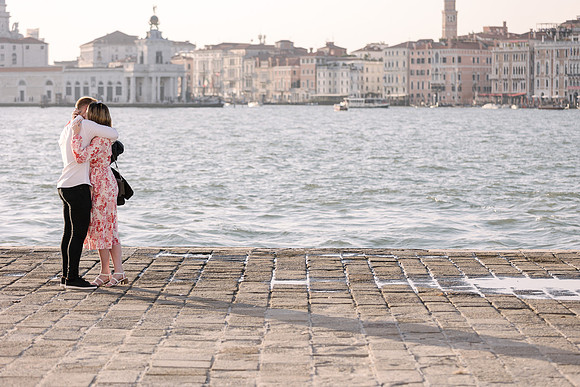Engaged couple on a water taxi ride in Venice