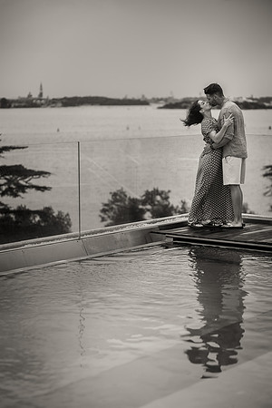 Couple standing together on a rooftop at JW Marriott Venice, admiring the lagoon view.