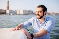 Man on boat ride with view of Venice canals