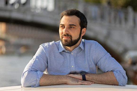 Relaxed portrait by Venetian canal