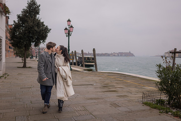 Romantic walk along Venice waterfront after proposal