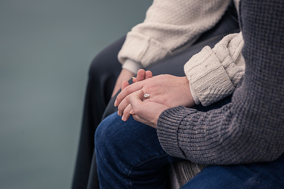 Close-up of engagement ring by Venice waterfront