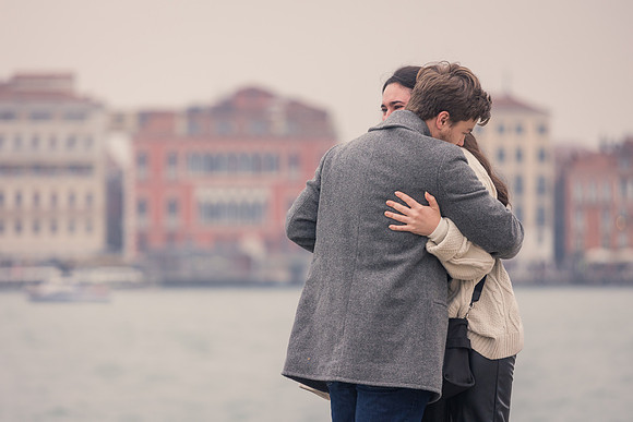 First embrace after romantic proposal in Venice