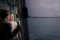 Couple sharing peaceful moment by Venice waterfront