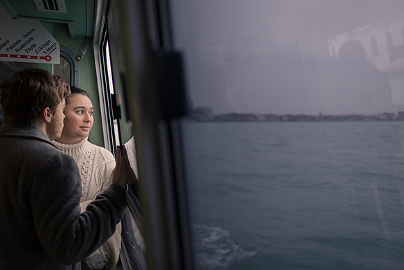 Couple sharing peaceful moment by Venice waterfront