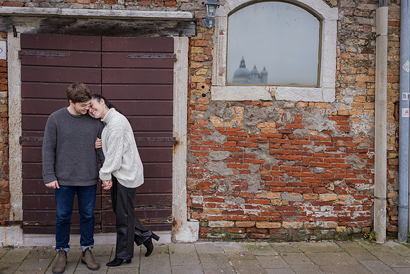 Strolling through quiet streets of Venice after engagement