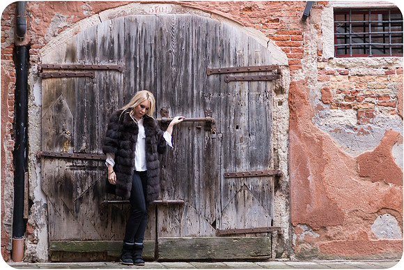 Winter portrait against aged Venetian doorway