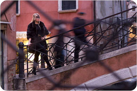 Crossing bridge in Venice during winter evening
