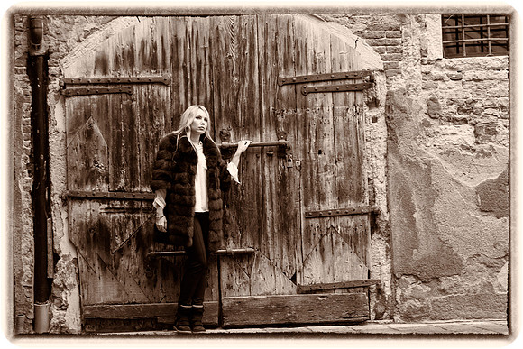 Vintage-style portrait by wooden door in Venice