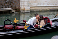 Engaged couple walking in a Venetian alley