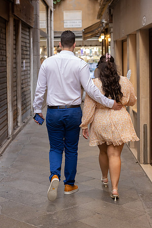 Couple walking in Venice before a surprise proposal