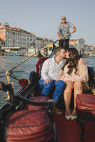 Engaged couple celebrating on gondola in Venice