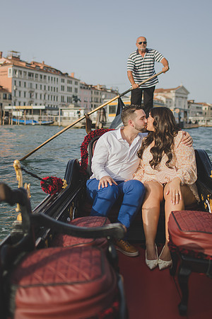 Engaged couple celebrating on gondola in Venice