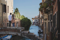 A couple pauses on a quiet bridge, setting the scene for an unforgettable moment.