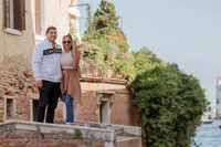 The couple walks together, soaking in their newly engaged bliss.