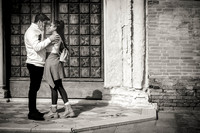 A stolen kiss in a quiet alley, capturing a truly intimate moment.