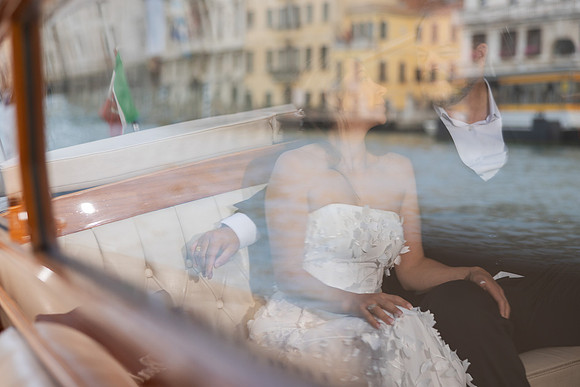 Looking out from water taxi at Punta della Dogana - Anniversary sunrise photoshoot in Venice.