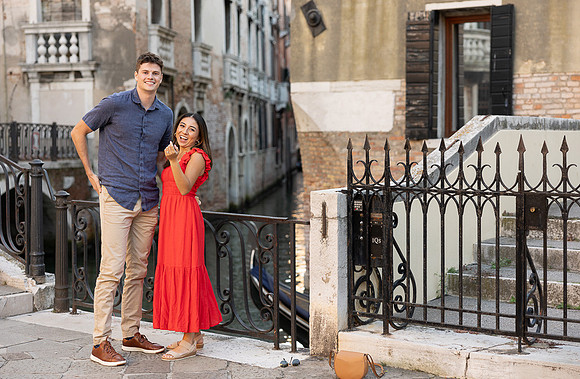 Engaged couple smiling after Venice proposal