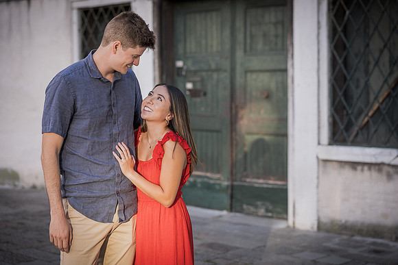 Engaged couple smiling together after proposal
