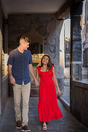 Couple walking through Venice after proposal
