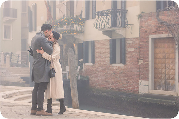 Intimate moment by Venice canal in winter mist
