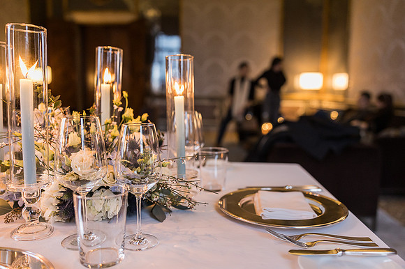 A beautifully arranged table with golden candlelight for a special evening.
