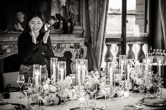 The bride-to-be signs a guest book, leaving a personal touch on the night.