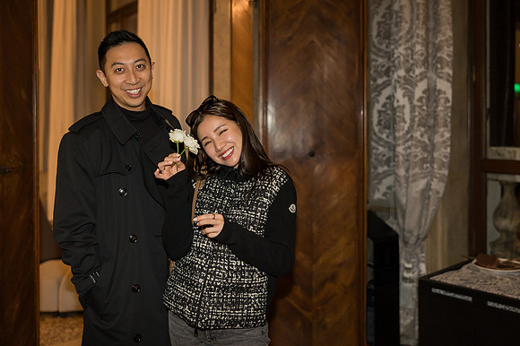 The newly engaged couple smiles as they commemorate the evening.