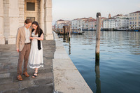 Just engaged couple hugging by canal