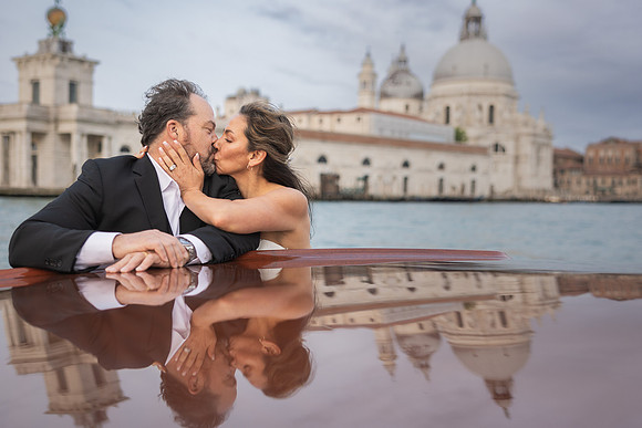 The couple looking lovingly into each other's eyes - Anniversary sunrise photoshoot in Venice.