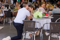 Woman saying yes to proposal at Café Florian