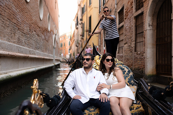 Mother enjoying a peaceful gondola ride through the Venetian canals