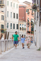 Family walking through the streets of Venice