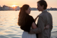 Couple walking hand in hand along canal