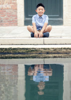 Child reflecting near the Venice canals