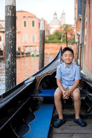 Portrait of child sitting by the Venice canals