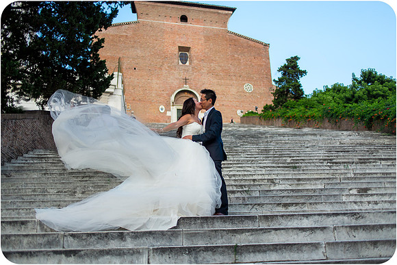 Bride and groom embrace in a scenic park in Rome during their honeymoon photoshoot.