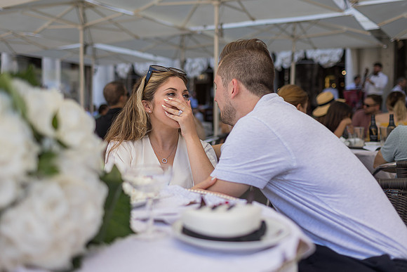 Engaged couple celebrating at Café Florian