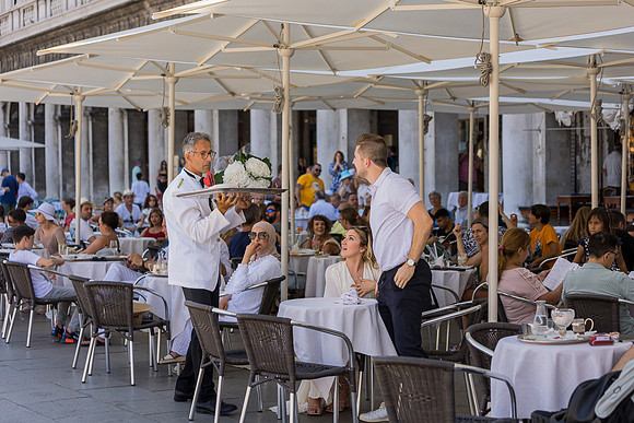 Couple toasting at Café Florian after proposal