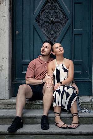 Romantic kiss in Venice's hidden corner after proposal
