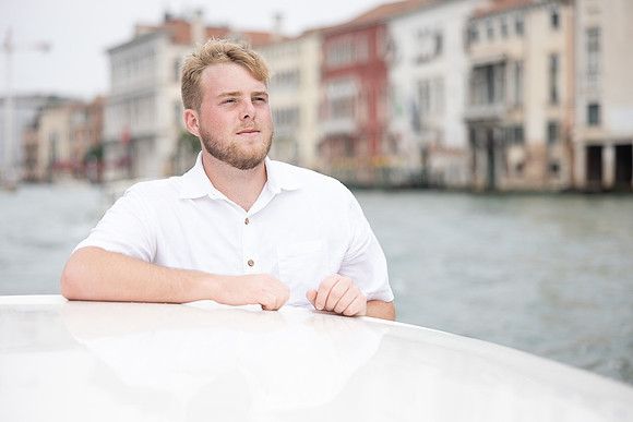 A romantic surprise proposal on a water taxi in Venice.