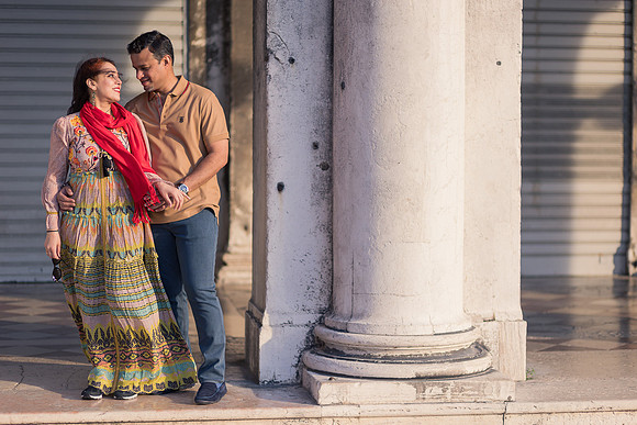 Couple posing by Venetian columns