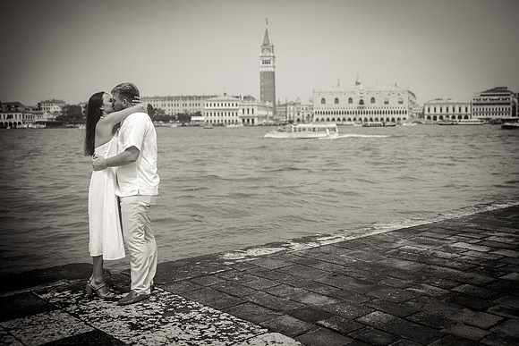 A quiet and intimate engagement moment on the Venetian waterfront.