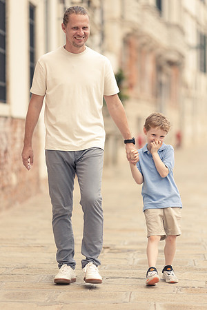 Father and son walking through the streets of Cannaregio, Venice.