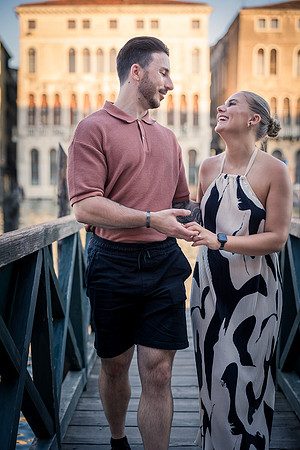 Couple walking in Venice alley after engagement