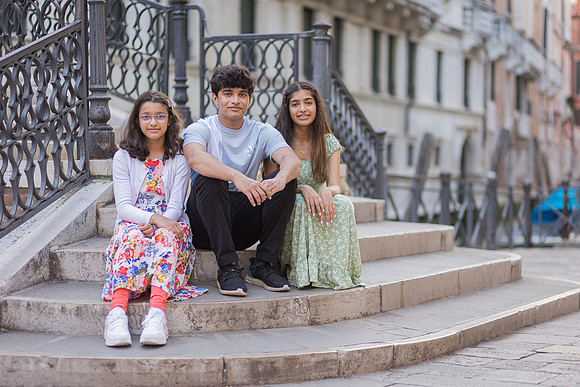 Children sitting on steps in Venice