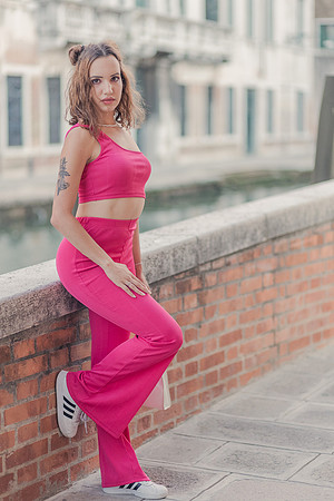 Model leaning by a Venice canal.