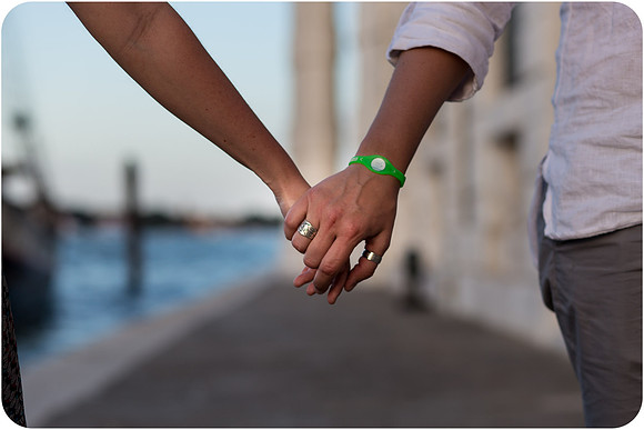 Lesbian couple holding hands in Venice.