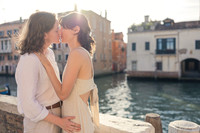 Partners embracing by Venice canals