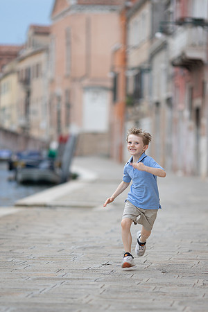 Boy exploring the streets of Cannaregio, Venice.